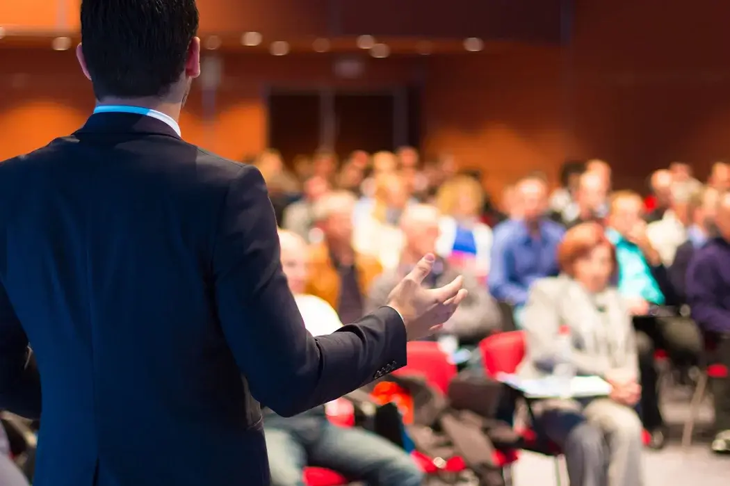 Ben speaking to an audience